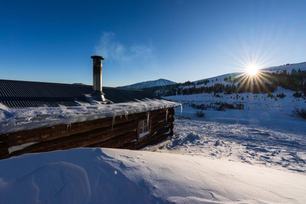 Summit Huts Kens Cabin Outside Sunset